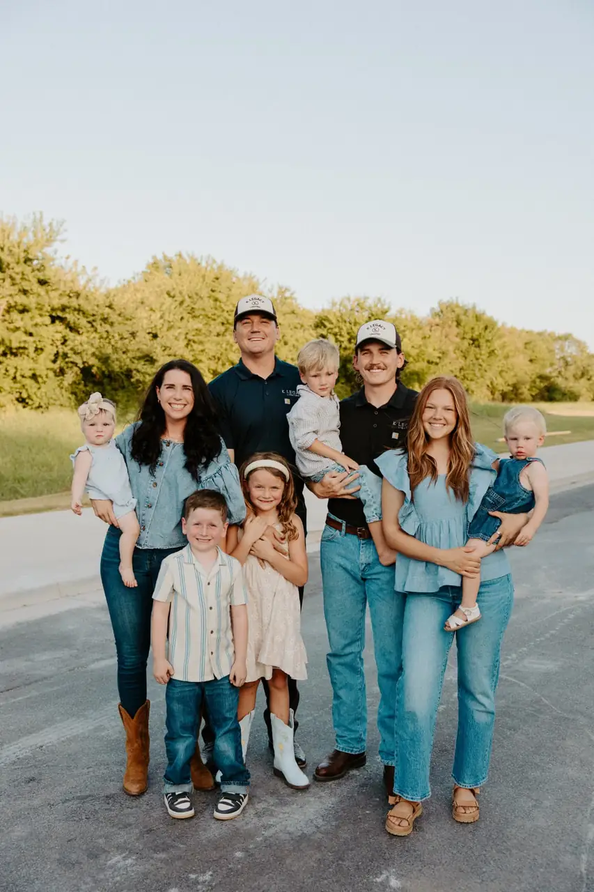 The Knowles family gathered together on a country road