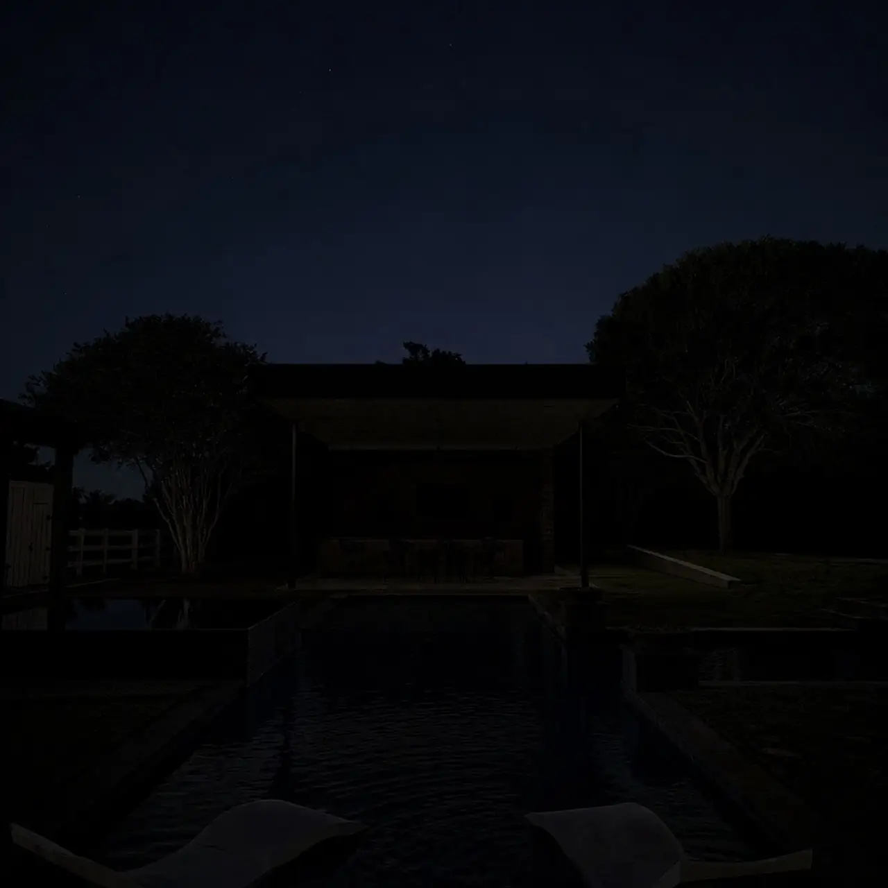 Backyard pavilion and pool before lighting installation